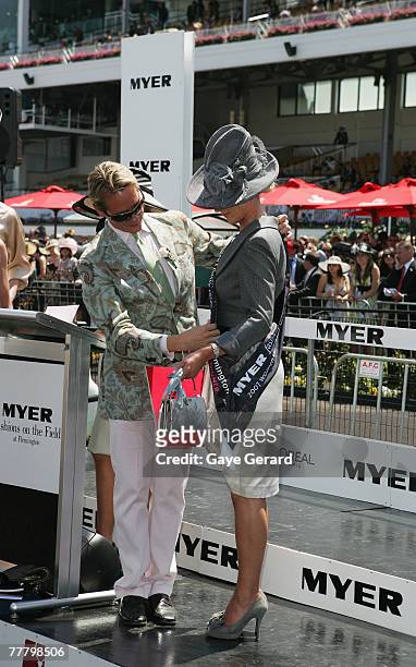 Stylist and fashion tv personality Carson Kressley places the Fashions on the Field best dressed winner's sash on Lorraine Cookson, during the Myer...