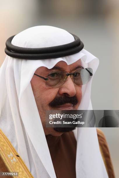 King Abdullah of Saudi Arabia pauses during a brief walking tour on Pariser Platz in front of the Brandenburg Gate November 8, 2007 in Berlin,...