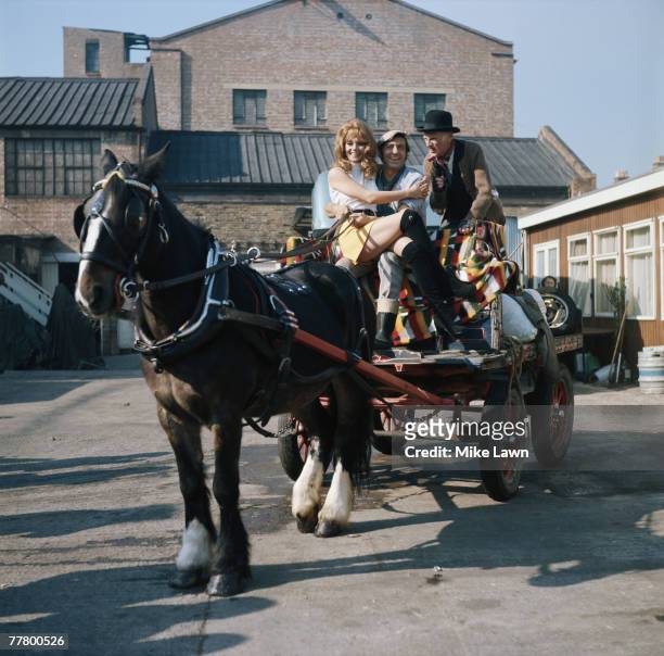 Carolyn Seymour, Harry H. Corbett and Wilfrid Brambell , during filming of the comedy 'Steptoe And Son', directed by Cliff Owen, 1971.
