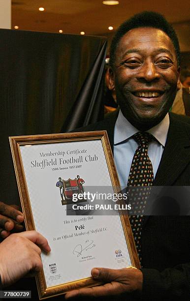Brazilian football legend Pele receives membersip of Sheffield FC, the oldest football club in the world, at the opening of an exhibition at...