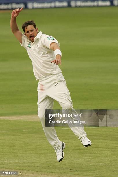 Shane Bond of New Zealand celebrates taking the wicket of Andre Nel of South Africa during day one of the first test match between South Africa and...