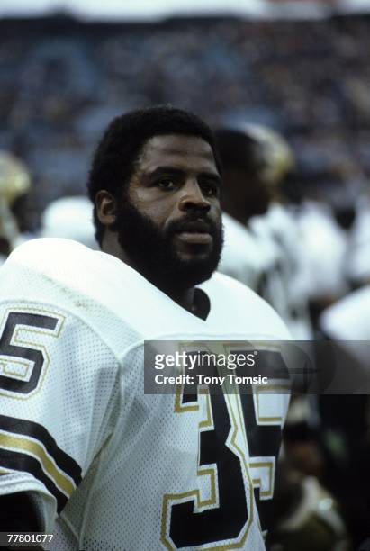 Runningback Earl Campbell of the New Orleans Saints watches the action from the sidelines during a game on October 28, 1984 against the Cleveland...