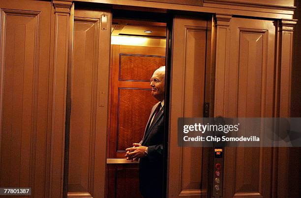 Sen. Larry Craig enters an elevator after walking off the Senate floor after a bipartisan group of Senators voted 79-14 to pass a $23 billion water...