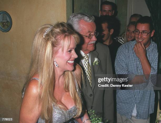 Joan Dangerfield walks down the aisle with her father while Adam Sandler ,right, looks on at Largo's Restaurant August 28, 2000 in Santa Monica, CA....