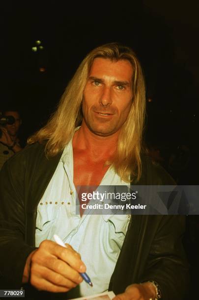 Model Fabio signs autographs outside Largo's Restaurant August 28, 2000 in Santa Monica, CA. Comedian Rodney Dangerfield renewed his vows with his...