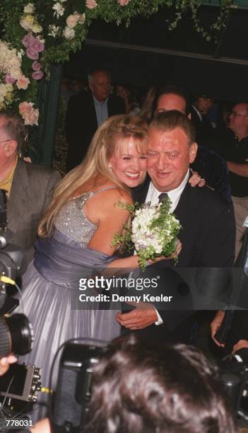 Rodney and Joan Dangerfield greet the media August 28, 2000 to announce their renewed wedding vows outside Largo's restaurant in Santa Monica, CA.
