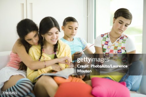 Friends Doing Math Homework Young Female Friends Doing Homework Together High-Res Stock Photo ...