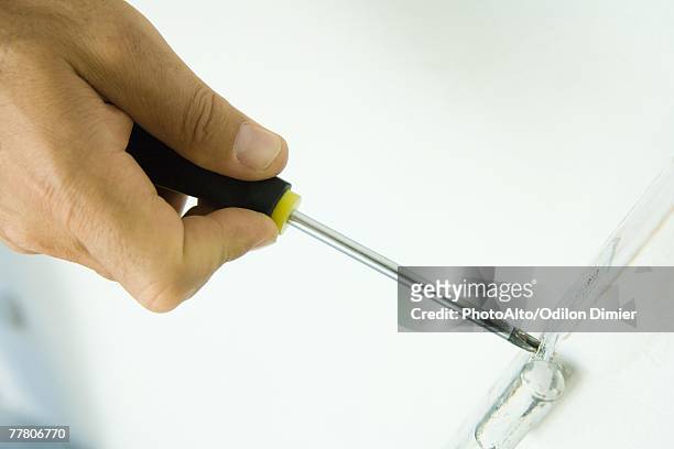 man using screwdriver, cropped view of hand - hinge stock pictures, royalty-free photos & images