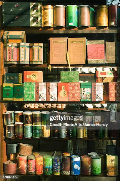 teas on shelf in tea shop - tea box stock pictures, royalty-free photos & images