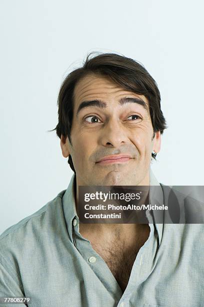 man making face, portrait - raised eyebrows stockfoto's en -beelden