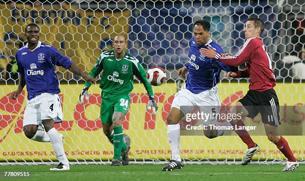 Joseph Jobo, Timothy Howard and Joleon Lescott of Everton defend against Marek Mintal of Nuremberg during the UEFA Cup Group A match between 1. FC...