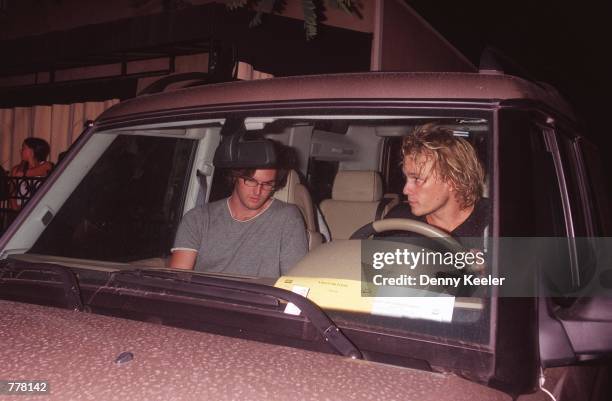 Actor Heath Ledger, right steps into his car with his friend outside Guy's nightclub August 29, 2000 in West Hollywood, CA.