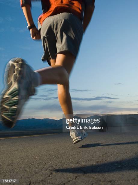 man in athletic gear running - triathlon gear stock pictures, royalty-free photos & images