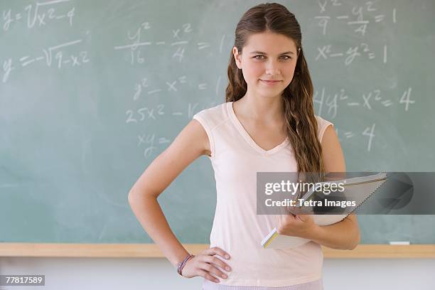 girl writing in classroom - algebra stock pictures, royalty-free photos & images