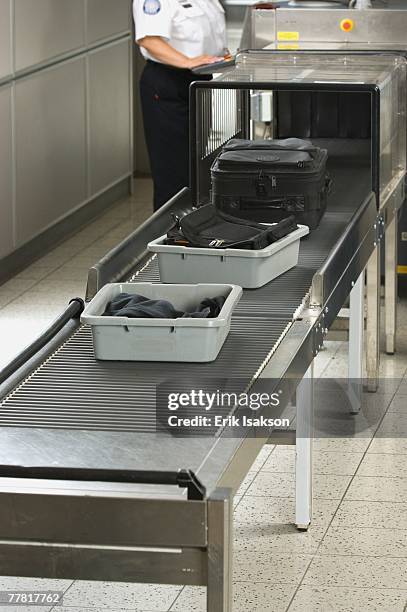 airport security worker checking baggage - airport authority stock pictures, royalty-free photos & images