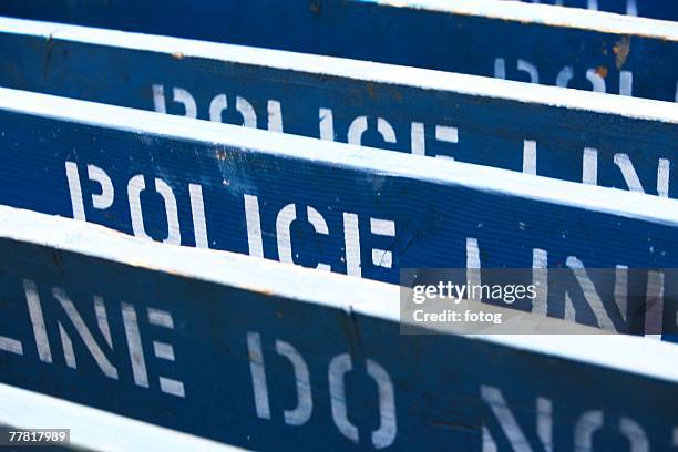 row of police line barriers - row police stock pictures, royalty-free photos & images