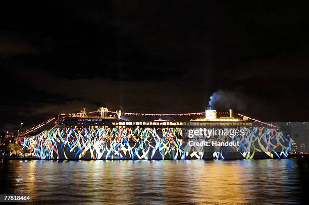 Australia's first superliner the 'Pacific Dawn' is seen during a light show at the naming ceremony for the vessel, at the Overseas Passenger Terminal...