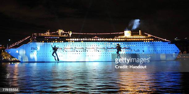 Australia's first superliner the 'Pacific Dawn' is seen during a light show at the naming ceremony for the vessel, at the Overseas Passenger Terminal...