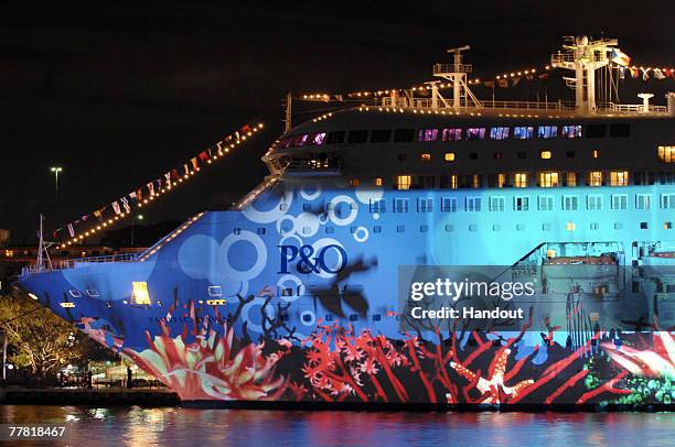 Australia's first superliner the 'Pacific Dawn' is seen during a light show at the naming ceremony for the vessel, at the Overseas Passenger Terminal...