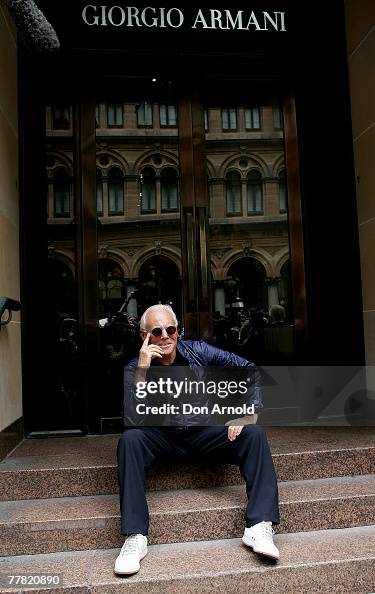 Giorgio Armani poses outside the Armani flagship store on November