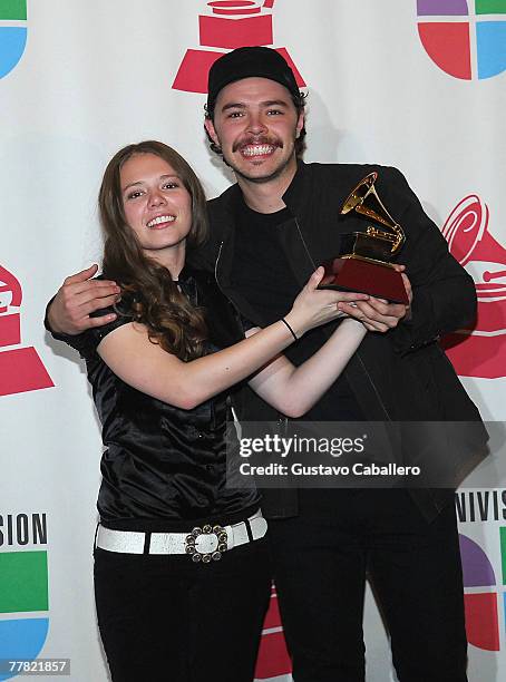 Musical group Jesse and Joy pose with their Best New Artist award in the press room during the 8th annual latin GRAMMY awards held at the Mandalay...