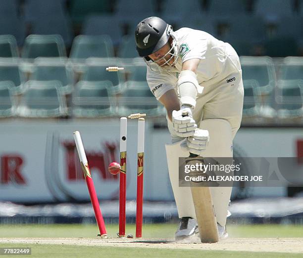 New Zealand's batsman Shane Bond is clean bowled by South Africa's bowler Dale Steyn 09 November 2007 on the second day of the first five-day Test...