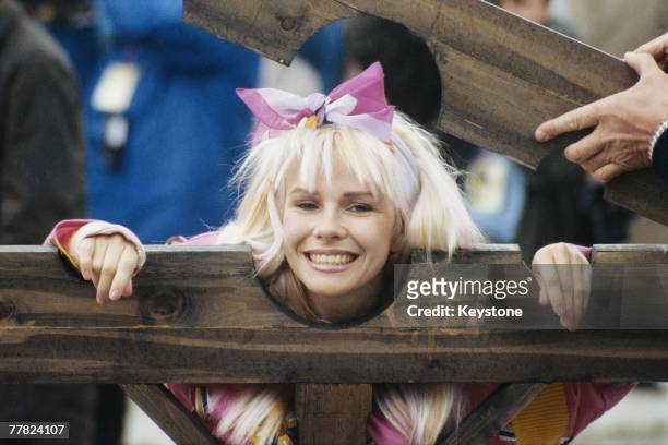 Australian actress and comedienne Pamela Stephenson is put in a pillory during a charity edition of the TV programme, 'It's A Knockout', 15th June...