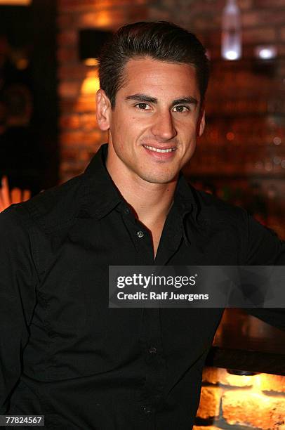 German Spyker MF1 driver Adrian Sutil poses at the opening of Mila Wiegands Exhibition "China" on November 08, 2007 in Duesseldorf, Germany.