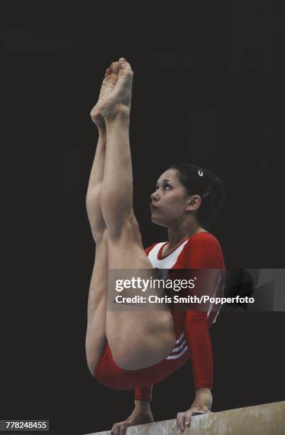 Soviet gymnast Nellie Kim pictured in action for the Soviet Union team on the balance beam during competition in the women's artistic team all-around...