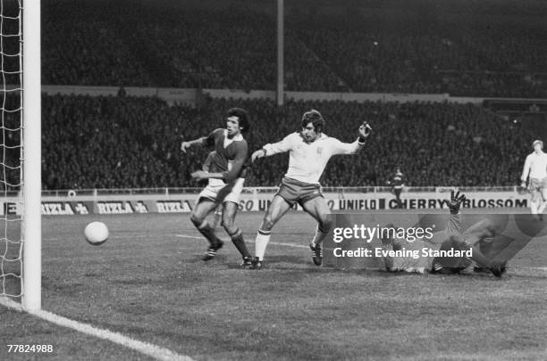 English footballer Malcolm Macdonald scores his third goal of the match in the 87th minute during a European Championship Qualifier between England...