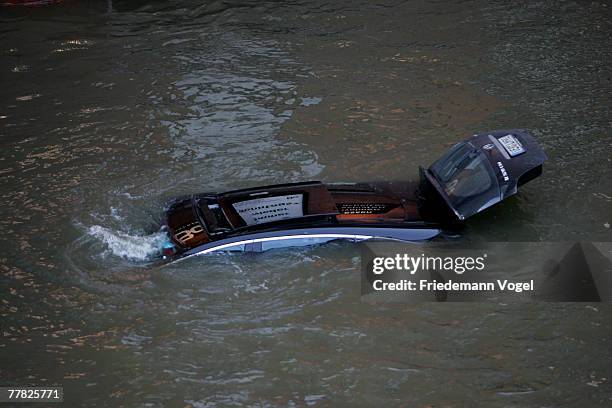 Sinking car is seen at the Fischmarkt during the flood on November 9, 2007 in Hamburg, Germany. The Hamburg fish market and other areas close to the...