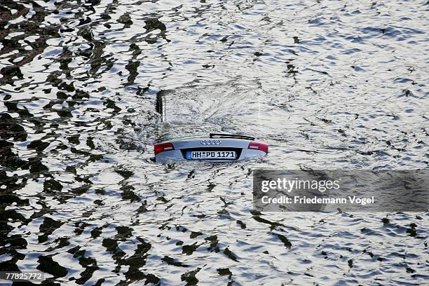 Sinking car is seen at the Fischmarkt during the flood on November 9, 2007 in Hamburg, Germany. The Hamburg fish market and other areas close to the...