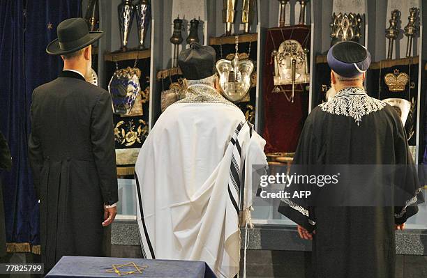 Chief Rabbi Yona Metzger, cantor Chaim Adler and Chief Rabbi Shlomo Moshe Amar bring a Torah roll to the synagogue of Cologne during a commemoration...