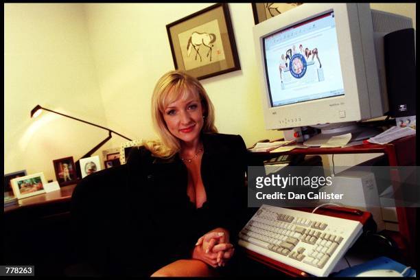 Business woman Danni Ashe poses in her office August 30, 2000 in Culver City, CA. Ashe owns "Danni Hard Drive" and is the host of the most downloaded...