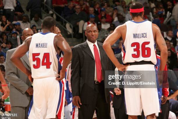 Assistant coach Michael Curry stands with Jason Maxiell and Rasheed Wallace of the Detroit Pistons during the game against the Atlanta Hawks on...