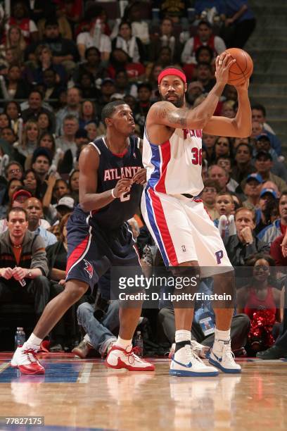 Rasheed Wallace of the Detroit Pistons goes up against Joe Johnson of the Atlanta Hawks during the game on November 4, 2007 at The Palace of Auburn...