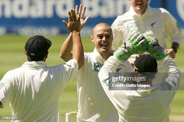 Chris Martin celebrates the wicket of Graeme Smith during day two of the 1st test match between South Africa and New Zealand held at the Wanderers...