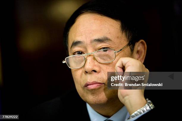 Zhou Shouwei, of the China National Offshore Oil Corporation, listens during a climate change seminar at the National Press Club November 9, 2007 in...