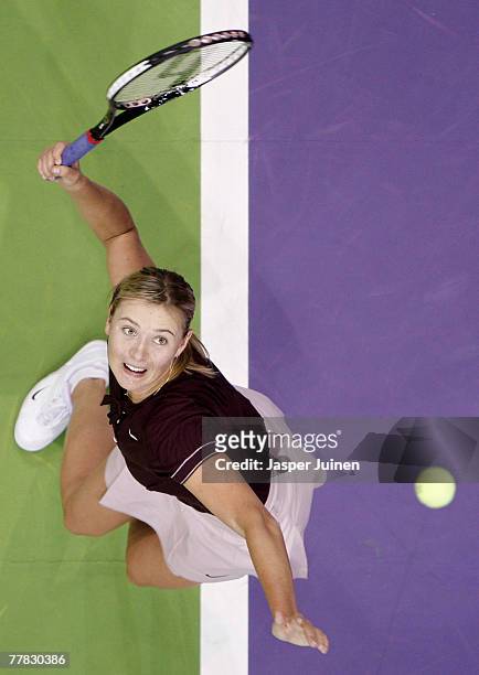 Maria Sharapova of Russia serves the ball to Anna Ivanovic of Serbia during day four of the Sony Ericsson WTA Tour Championships at the Madrid Arena...
