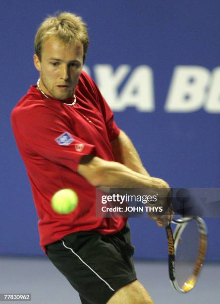 Tennis player Christophe Rochus returns the ball to Steve Darcis during their AXA Belgian Masters tennis tournament, in Gent, 09 November 2007. AFP...