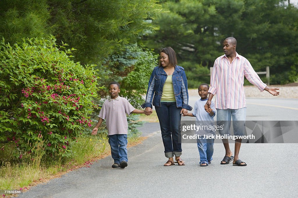 Couple walking with their two sons