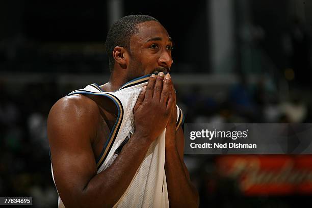 Gilbert Arenas of the Washington Wizards wipes his face against the Denver Nuggets at the Verizon Center on November 9, 2007 in Washington, D.C. NOTE...