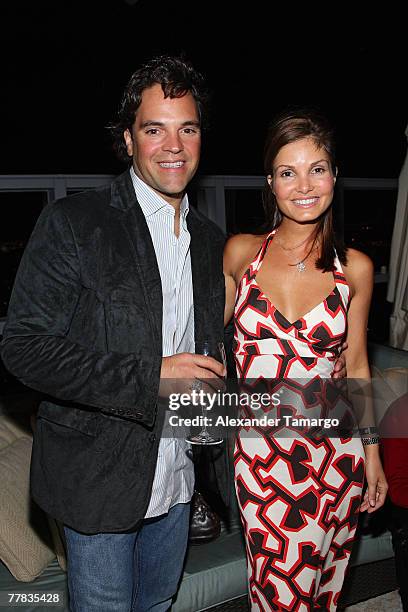 Mike Piazza and wife Alicia Piazza pose at the Setai Hotel penthouse during the Audemars Piguet party in celebration of the partnership with Miami...