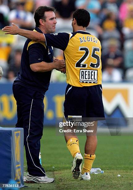 John Aloisi of the Mariners is congratulated by coach Lawrie McKinna after he was substitued during the round twelve A-League match between the...