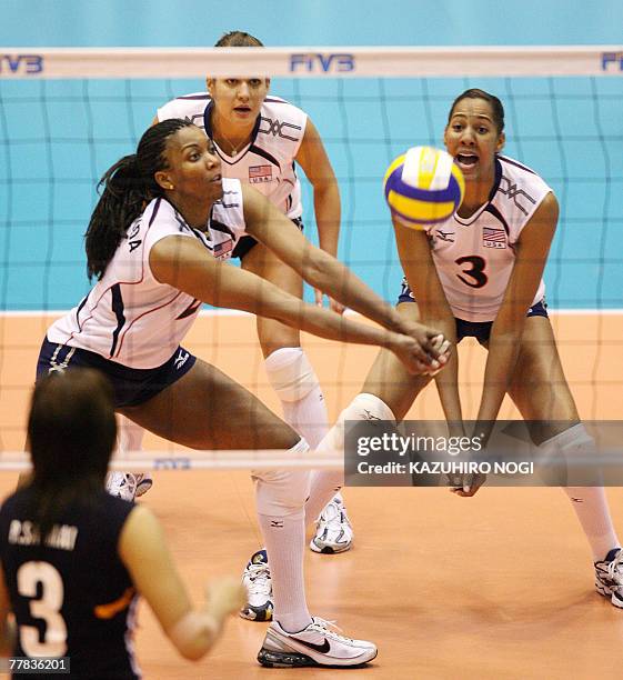 Player Danielle Scott-Arruda prepares to receive the ball while her teammates, Logan Tom and Tayyiba Haneef-Park look on during a match of the...