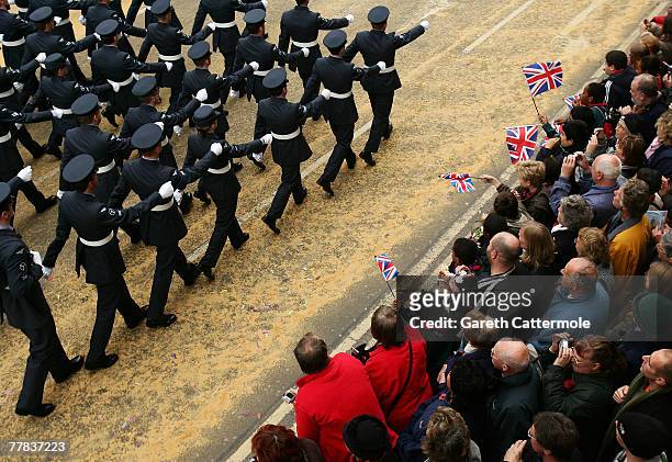 Members of the public wave flags during The Lord Mayor's Show on November 10, 2007 in London. The traditional yearly procession is 3 miles long and...