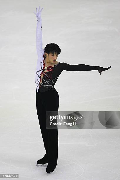 Gold medalist Johnny Weir of USA skates in the Men Free Skating during the Cup of China Figure Skating competition, which is part of the ISU Grand...