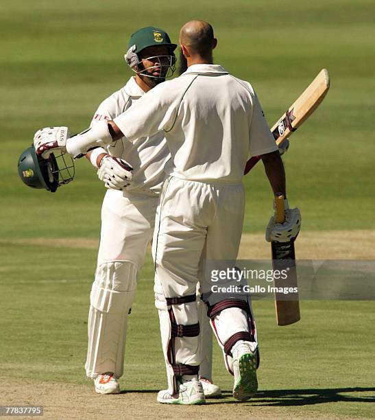 Ashwell Prince celebrates with Hashim Amla after scoring 150 runs during day three of the 1st test match between South Africa and New Zealand held at...