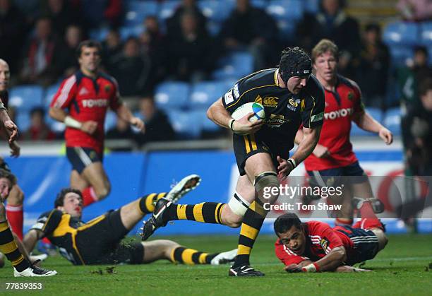 George Skivington of Wasps powers past the Munster defence on his way to scoring a try during the Heineken Cup match between London Wasps and Munster...