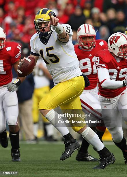 Ryan Mallett of the Michigan Wolverines runs out of the pocket to throw a pass against the Wisconsin Badgers on November 10, 2007 at Camp Randall...